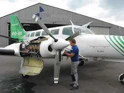 A Star Airservice technician prepares this Cessna 404 for an engine run. A Star Airservice technician prepares this Cessna 404 for an engine run.