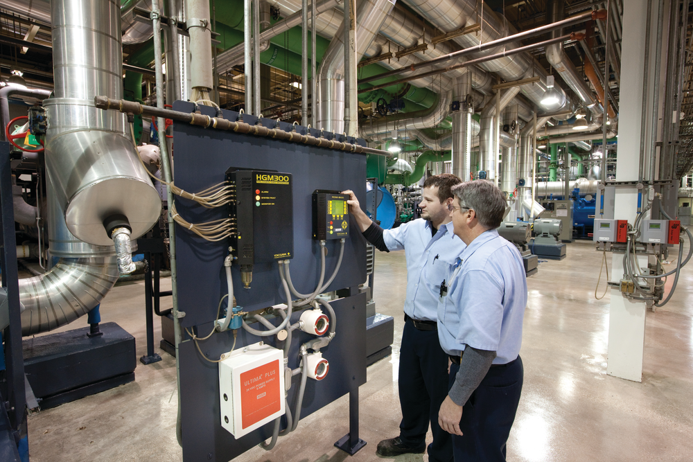 Operators reviewing refrigerant monitors.