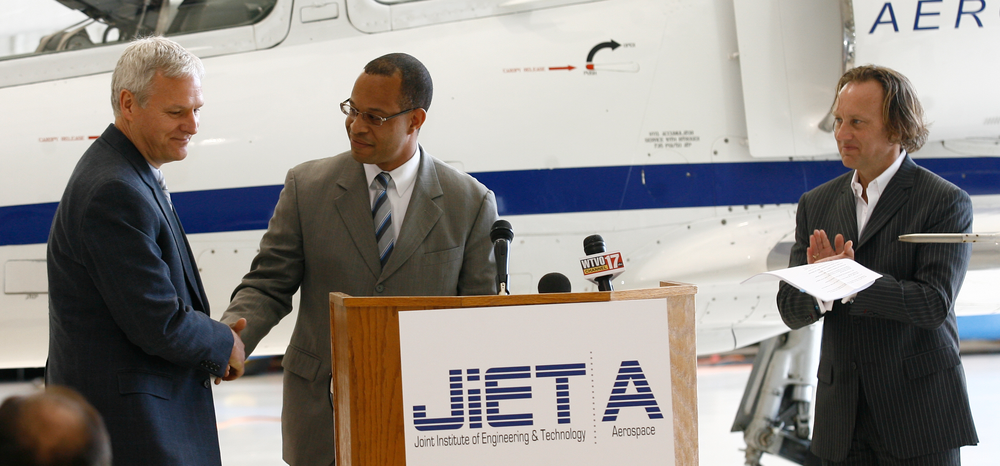 L-R Hamilton Sundstrand Electric Systems Director of Engineering Tom Gillis, GE Aviation Systems General Manager Carlos Miller and Kaney Group CEO Jeff Kaney at the news conference that announced the Rockford, Illinois aerospace cluster is building up its own talent pipeline. The event occurred on May 23 at Kaney Aerospace, Rockford, Illinois.