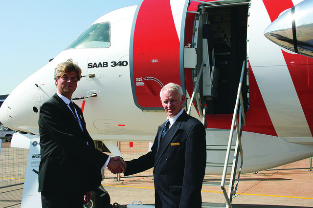 Johan R&auml;ttvall, Director Marketing & Sales, Maritime Surveillance Area, Saab (left) and Steve Bothma, Maintenance Director ExecuJet South Africa (right) celebrate the agreement.