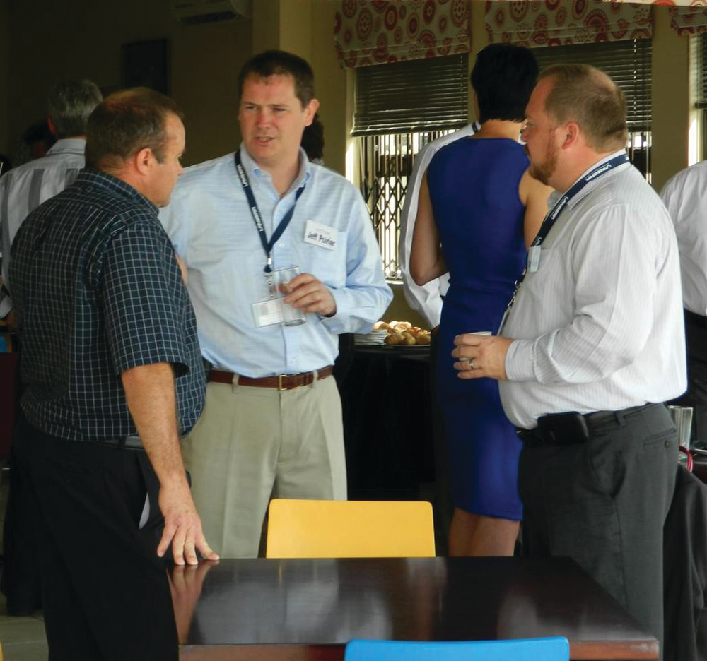 Jeff Poirier, center, president of Vector Aerospace Engine Services - Atlantic and Mark O&rsquo;Keefe, right, vice president of finance for Vector Aerospace Engine Services - Atlantic, chat with Theo Prinsloo, left, military contracts manager with Execujet South Africa during the PT6A Customer Day event held recently at Vector&rsquo;s Designated Overhaul Facility in Johannesburg, South Africa.