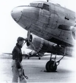 Tony Vasko, a CAP Cadet at age 15, holds a 10-pound CO2 extinguisher to be used, if needed, on the C-47 in the picture. 'If I look worried,' he says, 'I was.' Tony Vasko, a CAP Cadet at age 15, holds a 10-pound CO2 extinguisher to be used, if needed, on the C-47 in the picture. 'If I look worried,' he says, 'I was.'
