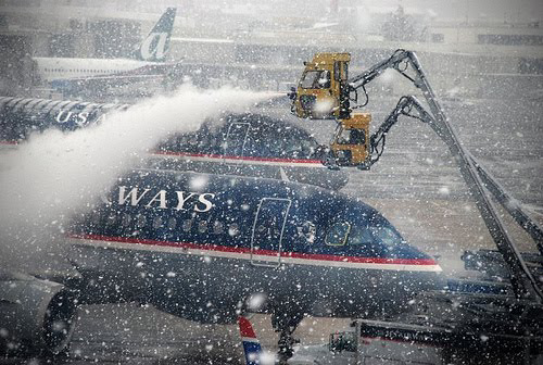 One of the main reasons for the delays, according to the memo, were air traffic controllers not posting a ground stop early enough to stop flights as snow rolled. The other reason: a 'communications breakdown' between airport personnel and air traffic control about deicing and snow removal.