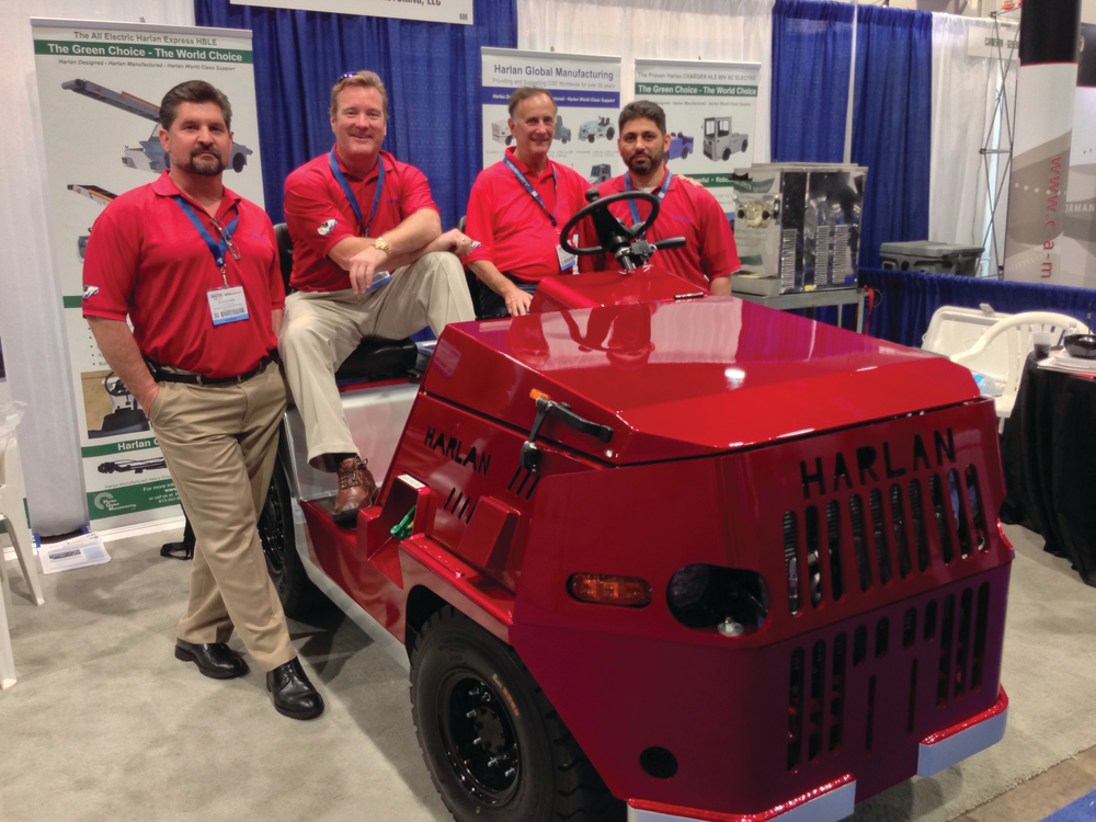 Harlan executives gather around the company's Trans-Con Model HTSB, unveiled at Harlan's booth at last week's AviationPros LIVE trade show in Las Vegas, NV.