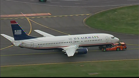 Maintenance crews put a new tire on the aircraft and towed it back to the gate.