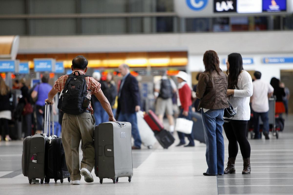 A joint task force of LAX and Los Angeles Police Department detectives swarmed the airport and the homes of some suspects late Wednesday night, detaining 14 people as they collected evidence.