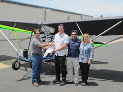 FAA Aviation Safety Inspectors John Soltis (L) and Kym Robbins (R), hand pink airworthiness certificate to Quicksilver Aeronautics principals Will Escutia (white shirt) and Dan Perez at the French Valley Airport. FAA Aviation Safety Inspectors John Soltis (L) and Kym Robbins (R), hand pink airworthiness certificate to Quicksilver Aeronautics principals Will Escutia (white shirt) and Dan Perez at the French Valley Airport.