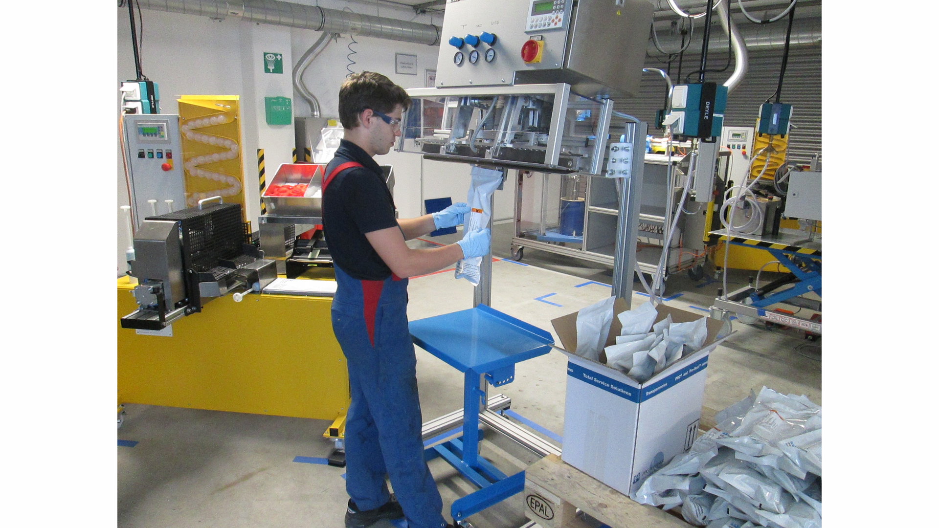 Value-Added Packaging Operator Viktor Merklinger fills a SEMKIT(R) package with high-performance, lightweight aerospace sealant on new equipment at PPG Industries&rsquo; (NYSE:PPG) Central Europe application support center in Hamburg, Germany.