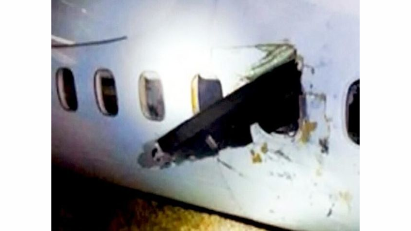 Rough landing reportedly caused a blade to break off the plane's right propeller, sending it flying into the plane, where it sliced through the cabin wall.