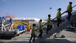 Cleaners from ground handler SATS walk up the staircase to an airplane. SATS workers recover thousands of items left on planes every year. Cleaners from ground handler SATS walk up the staircase to an airplane. SATS workers recover thousands of items left on planes every year.
