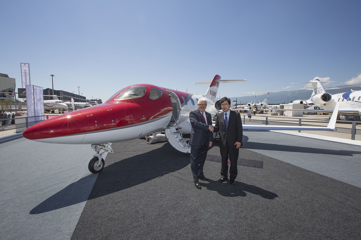 Graham Williamson, TAG Aviation Europe's President Aircraft Management and Charter Services (left) is pictured with Michimasa Fujino, Honda Aircraft Company's President and CEO, in front of a HondaJet demonstration aircraft at EBACE 2015 in Geneva, on Monday 18 May 2015.