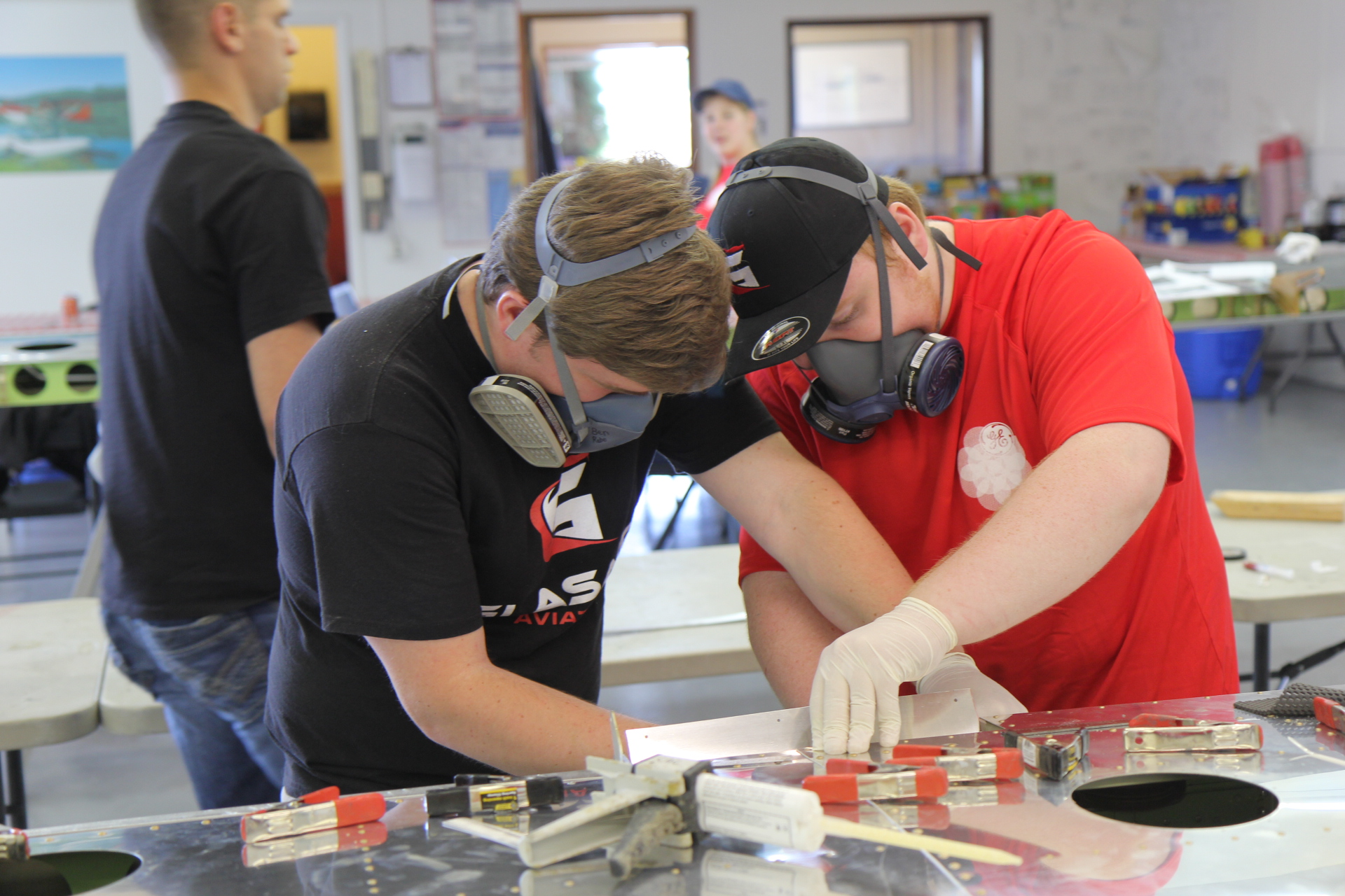 Jonathan Smythe uses adhesive on the trailing edge of the wing.