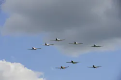 Vintage military aircraft in Japanese WWII markings fly during the performance of the Tora Tora Tora re-enactment of the Pearl Harbor attack. Flown during EAA AirVenture 2013. Vintage military aircraft in Japanese WWII markings fly during the performance of the Tora Tora Tora re-enactment of the Pearl Harbor attack. Flown during EAA AirVenture 2013.