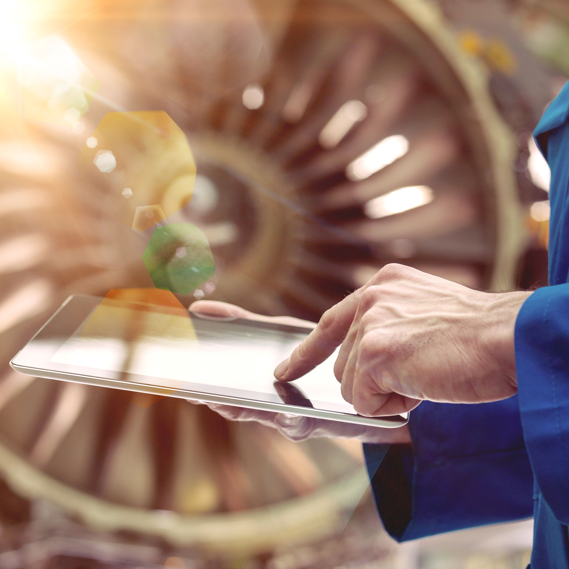 An engineer checks data from a Rolls-Royce engine