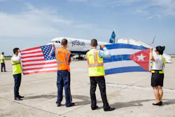 Crewmembers at the Santa Clara Abel Santamaría International Airport in Cuba welcome JetBlue flight 387, the first commercial flight to Cuba from U.S. in more than 50 years. Crewmembers at the Santa Clara Abel Santamaría International Airport in Cuba welcome JetBlue flight 387, the first commercial flight to Cuba from U.S. in more than 50 years.