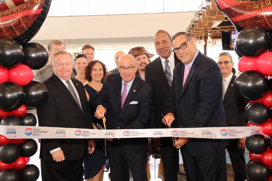 Cutting the ribbon, left to right, Robert Watkins, chairman, Hillsborough County Aviation Authority; Laurie Noyes, director of concessions, Tampa International Airport; Joe Lopano, CEO, Tampa International Airport; George Tinsley, president & CEO, Tinsley Family Concessions; Michael Price, vice president of business development, HMSHost.