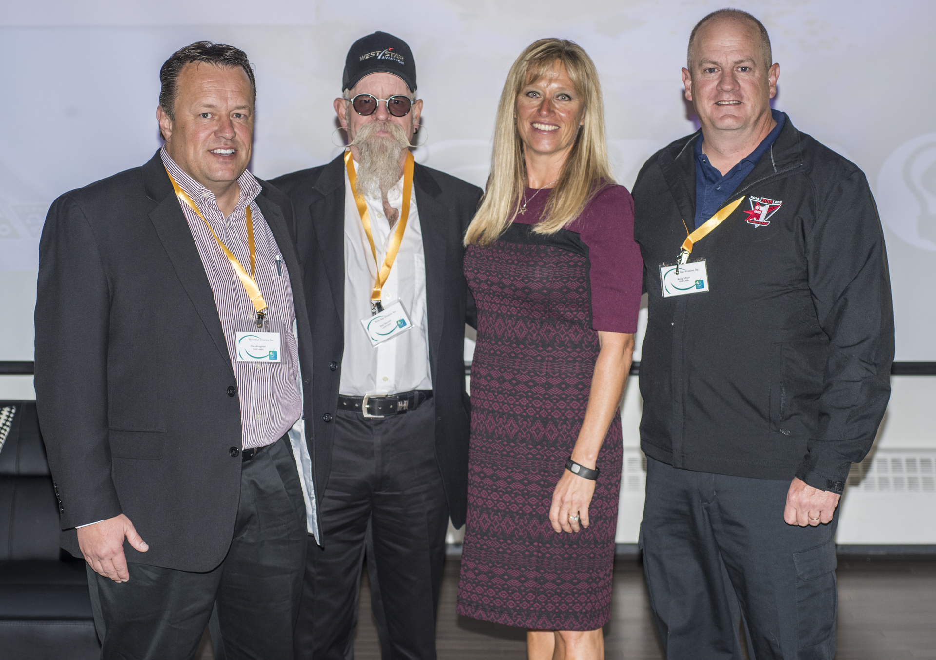 Environmental Leadership Program Awards Ceremony. From Left to Right: Dave Krogman and Sam Haycraft, West Star Aviation, Lynette Myers, Department of Colorado Public Health and Environment, Kraig Meyer, West Star Aviation.