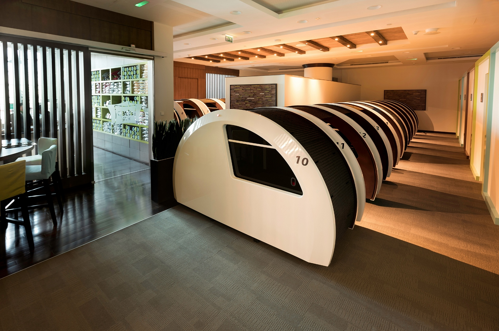 The lounge contains sleeping pods for passengers.