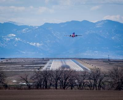 An aircraft departs runway 8/26 at Denver International Airport.
