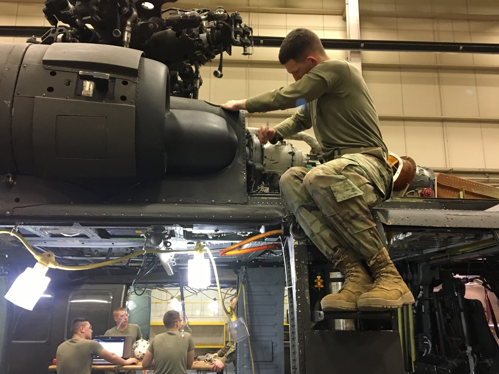 Soldiers with B Company, 2-210th Aviation Regiment, 128th Aviation Brigade, U.S. Army Aviation Center of Excellence, learn to repair a UH-60 helicopter as part of Military Occupation Specialty 15T training at 128th Aviation Brigade at Joint Base Langley-Eustis, Virginia.