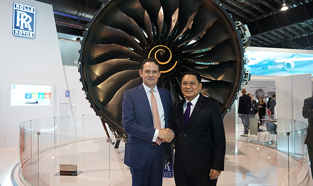 Ewen McDonald and Surachai Piencharoensak are celebrating the signature.