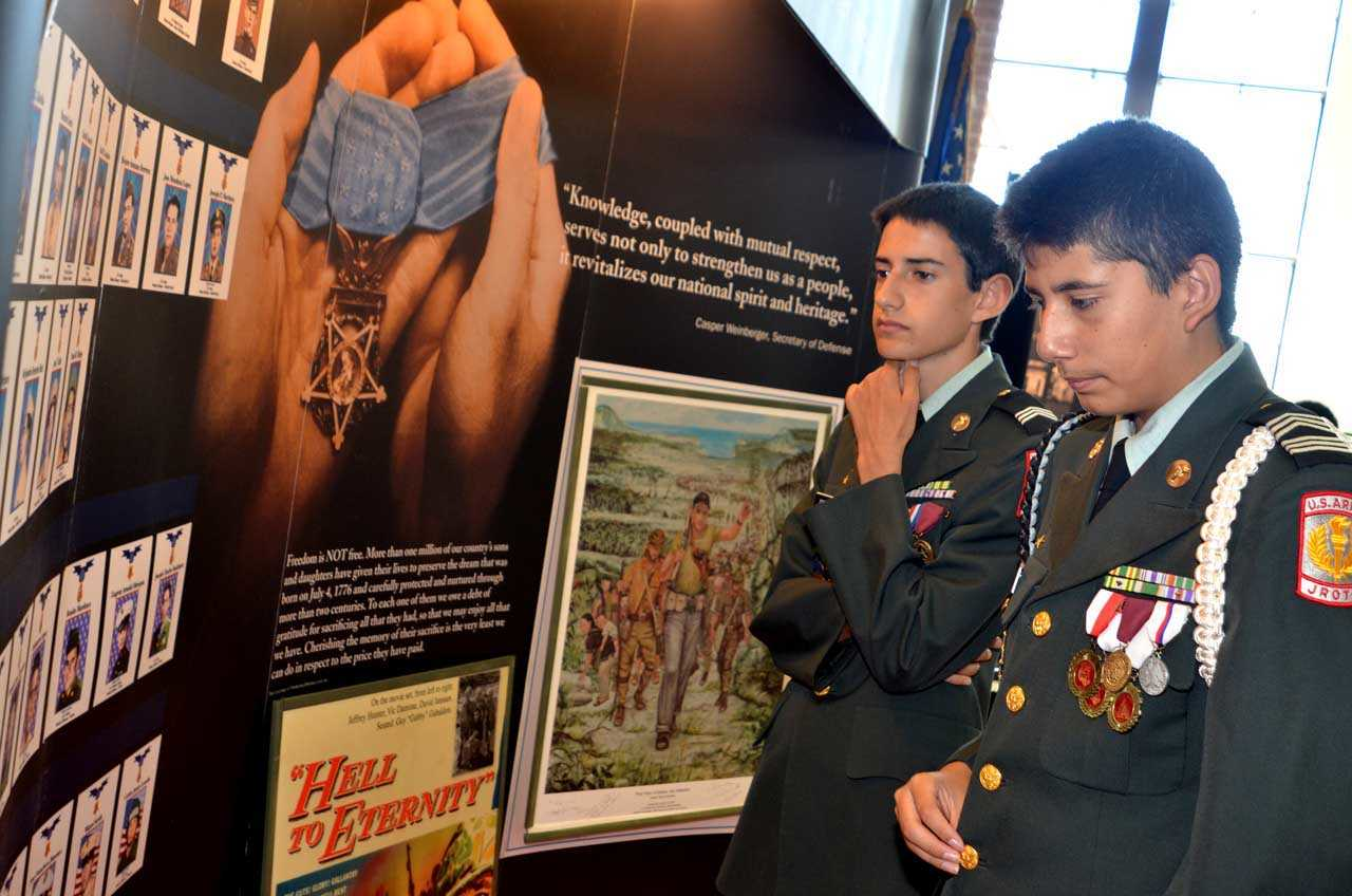 Young JROTC cadets study part of the Hispanic Medal of Honor exhibit that will be on display this year at the 15th annual World War II Heritage Days, April 21-22 at the CAF Dixie Wing Warbird Museum and grounds in Peachtree City, Ga. This year the CAF Dixie Wing is saluting all WWII Medal of Honor recipients.