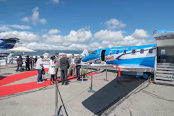 Exhibitors and attendees explore the static display at Geneva International Airport. Exhibitors and attendees explore the static display at Geneva International Airport.