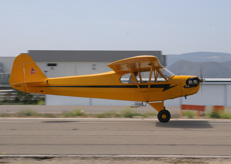 A vintage Piper Cub touches down at the Lompoc Airport during a previous WEST COAST CUB FLY-IN event. This year marks the fly-in's 34th anniversary.