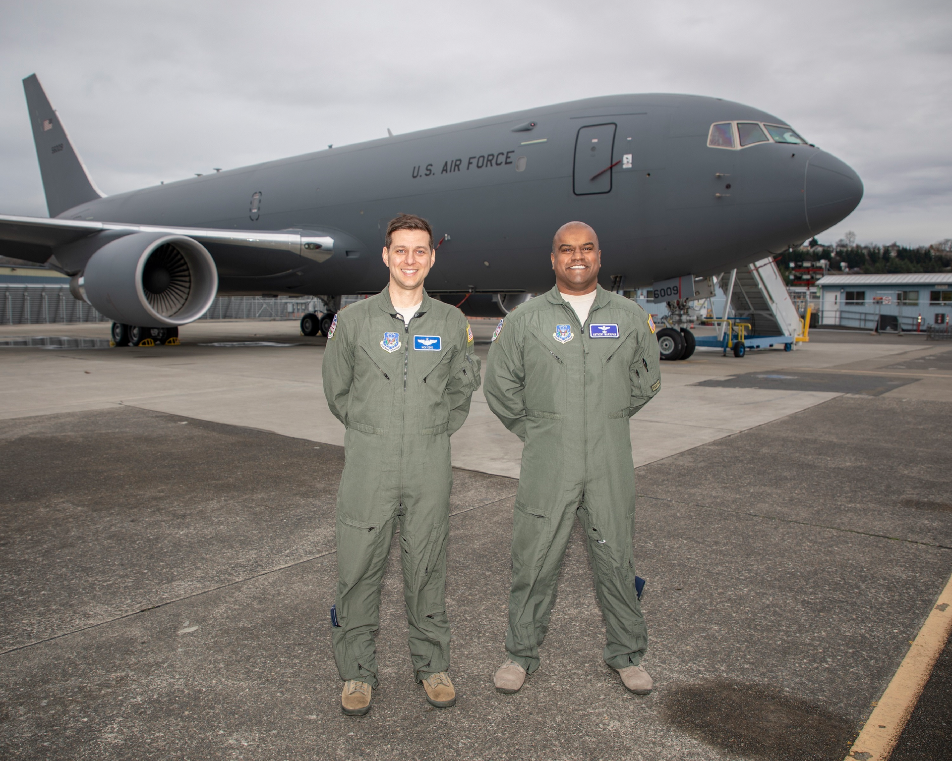 Nick Cenci, Major, USAF Chief of Flight Operations DCMA (Seattle) (left) and Anthony Mariapain, Major, USAF KC-46 Chief Pilot DCMA (Seattle) stand in front of the KC-46A Pegasus at Boeing Field in advance of the U.S. Air Force acceptance of Boeing&rsquo;s first tanker. Maj. Cenci and Maj. Mariapain led flight acceptance testing on the jet.
