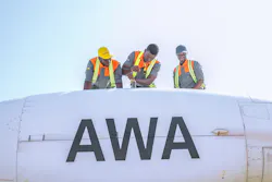 Africa World Airways technicians finishing a maintenance task on left engine. Africa World Airways technicians finishing a maintenance task on left engine.