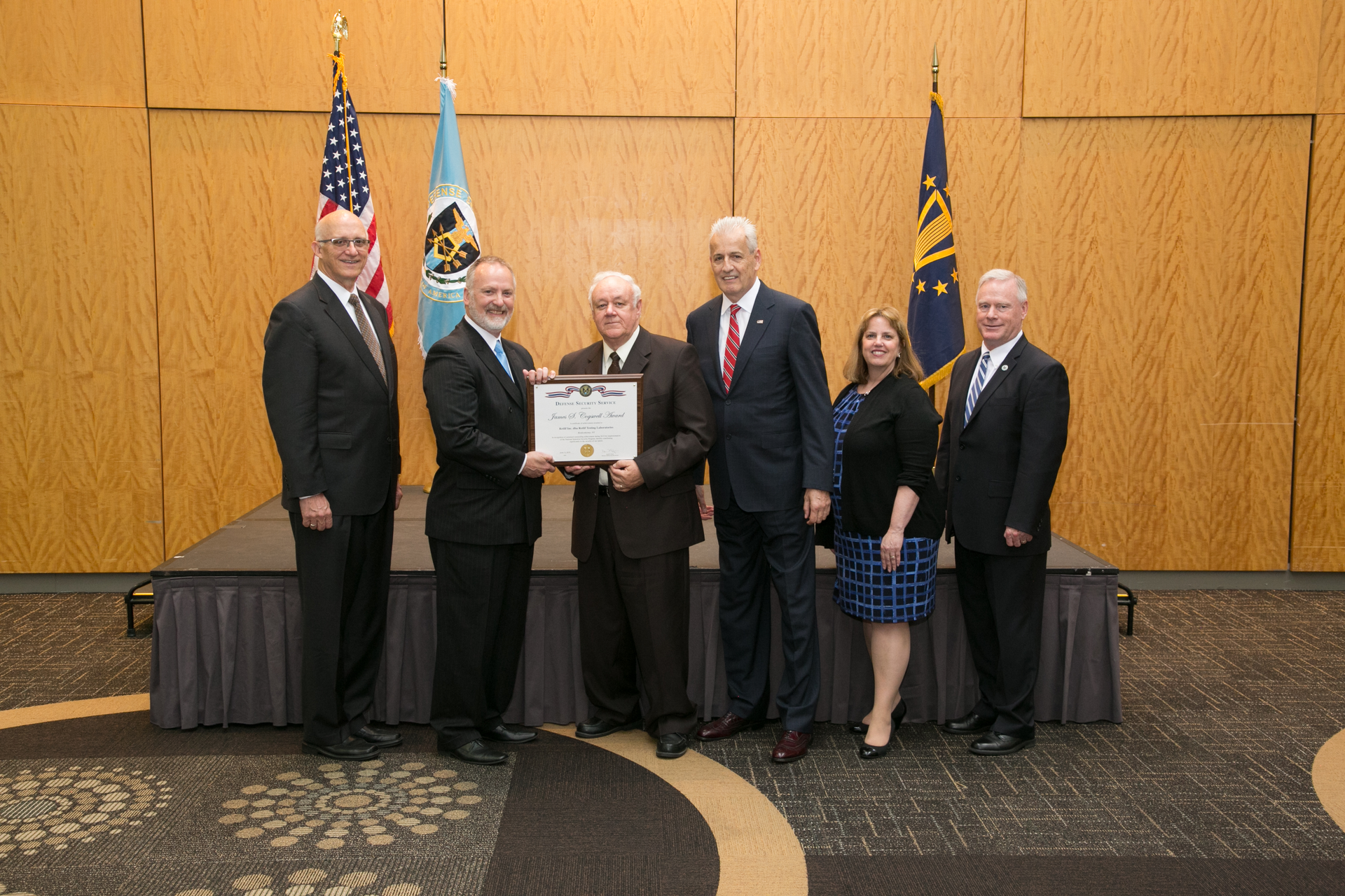 Pictured from left to right during Retlif Testing Laboratories&rsquo; presentation of its Cogswell Outstanding Industrial Security Achievement Award by the Defense Security Service (DSS) are: Gus Green, Director of Industrial Security Field Operations, Defense Security Service; Dan Payne, Director, Defense Security Service; Donald Dwyer, Assistant Facility Security Officer, Retlif Testing Laboratories; William Hayes, Facility Security Officer and Executive Vice President, Retlif Testing Laboratories; Cheryl Matthew, Northern Regional Director, Defense Security Service; and Mike Halter, Deputy Director Industrial Security Field Operations, Defense Security Service.
