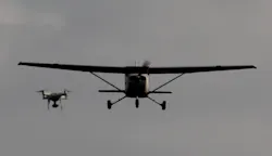 A drone is shown encroaching on a small aircraft in flight. Photo courtesy of A drone is shown encroaching on a small aircraft in flight. A drone is shown encroaching on a small aircraft in flight. Photo courtesy of A drone is shown encroaching on a small aircraft in flight.