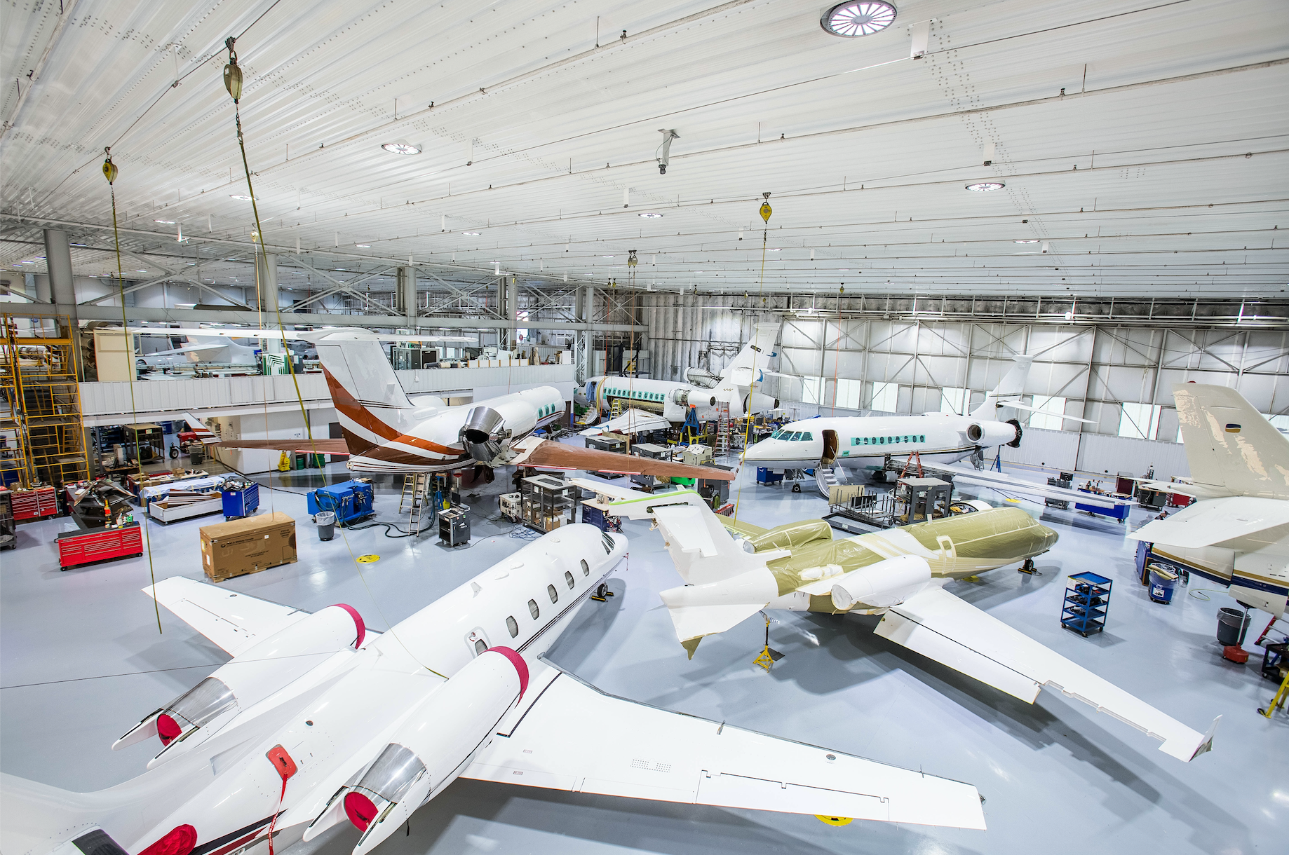 Dialight Vigilant LED High Bay hanging over an airplane in Duncan Aviation&rsquo;s Battlecreek, Michigan hangar. The LED lights drastically improved the facility&rsquo;s visual acuity.