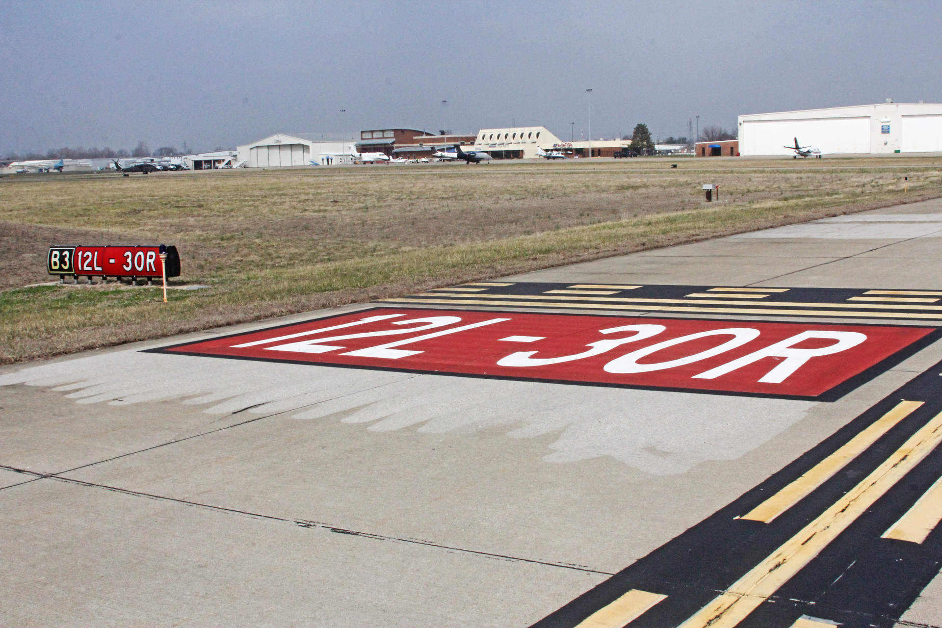 St. Louis Downtown Airport obliterated and replaced surface painted signs and two intersections were completely relocated away from the runway.