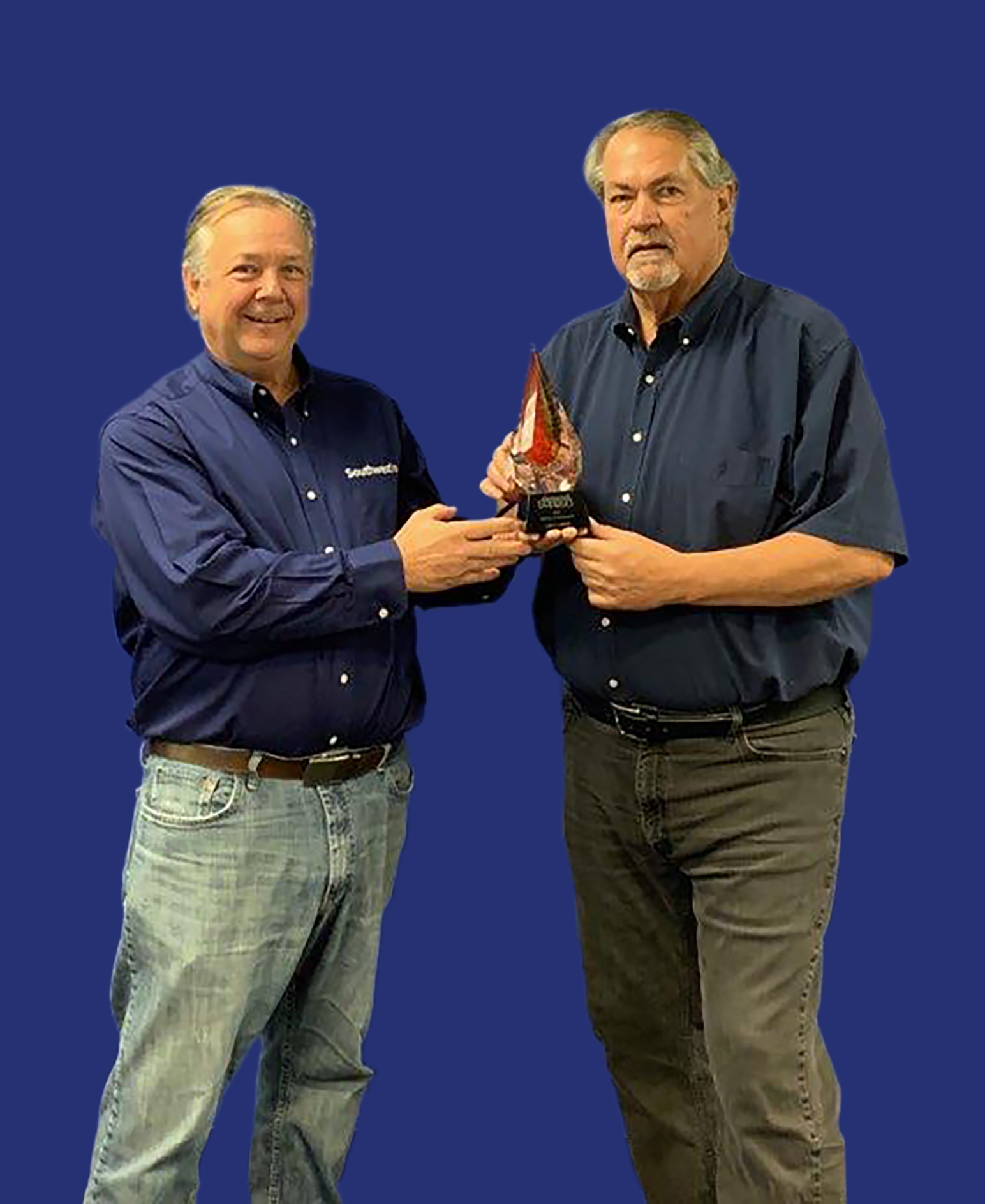 Don Redwine (left) presents the Lifetime Achievement award to Larry Laney.