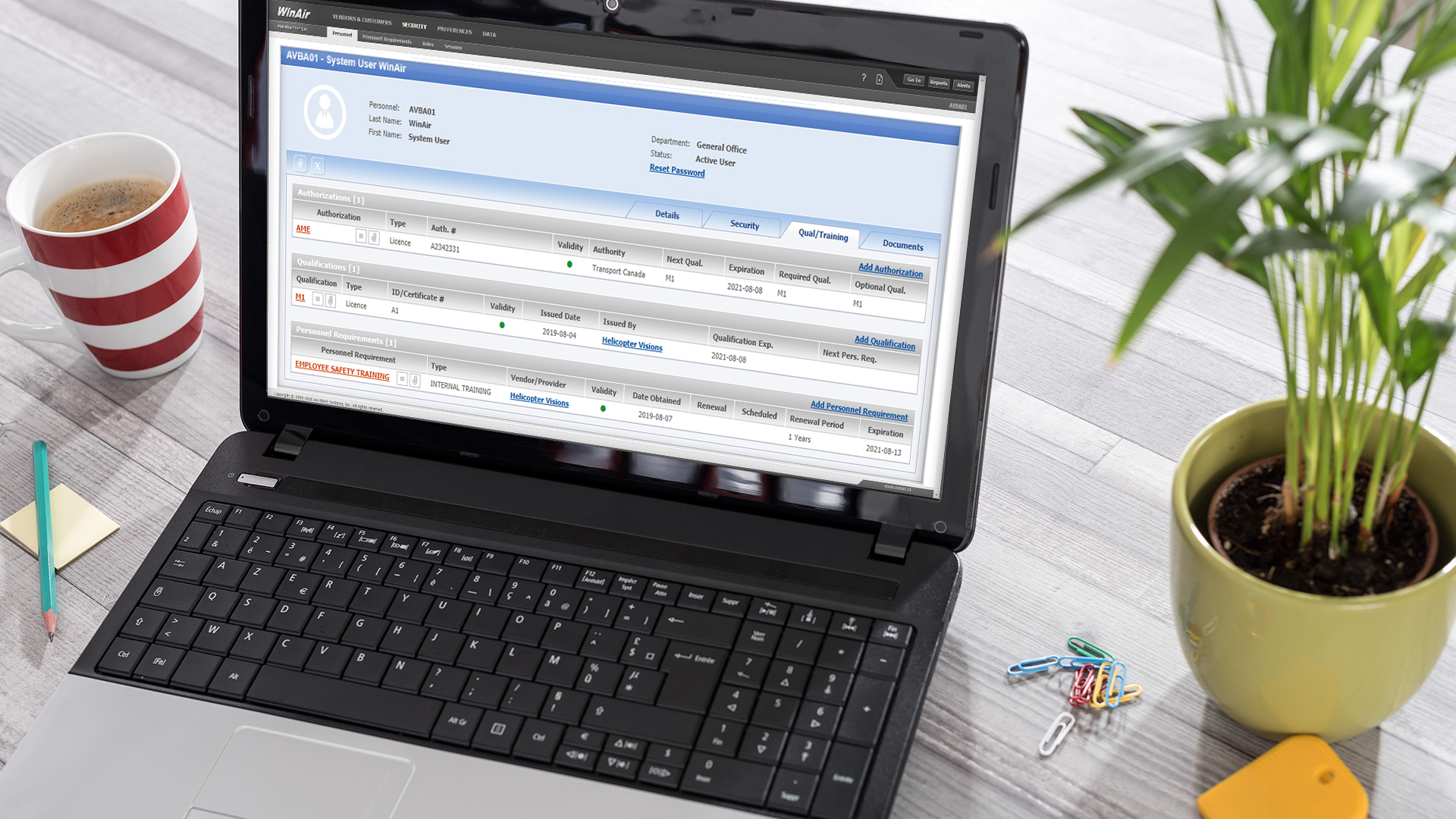 Win Air Training Qualification System Displayed On Laptop Aviation Management Software