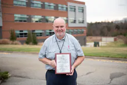 Program Director for the Aviation Electronics Technology Program at Guilford Technical Community College, Larry Belton, with the Charles Taylor Master Mechanic Award. Program Director for the Aviation Electronics Technology Program at Guilford Technical Community College, Larry Belton, with the Charles Taylor Master Mechanic Award.