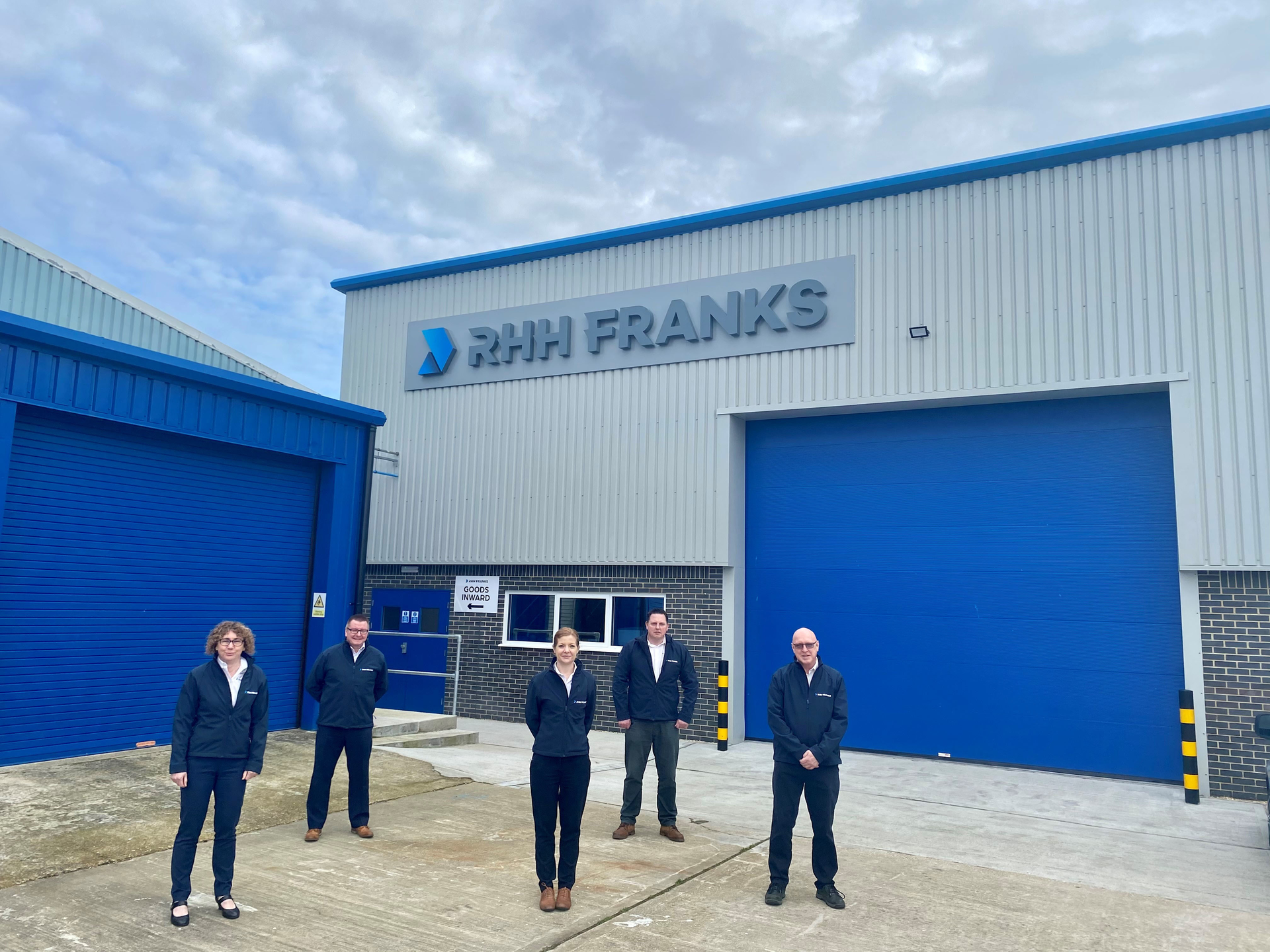 Managing director Elsa Hogan, front center, with staff at RHH Franks. The firm is marking its 60th anniversary with a rebrand.