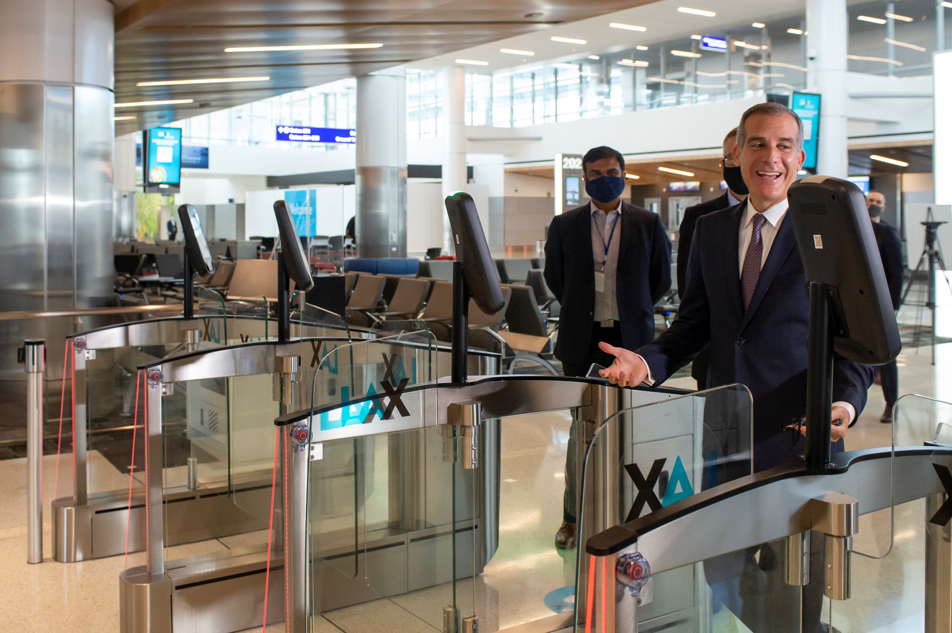 LA Mayor Eric Garcetti going through the new automated biometric boarding gates at LAX during the West Gates inauguration on May 24.