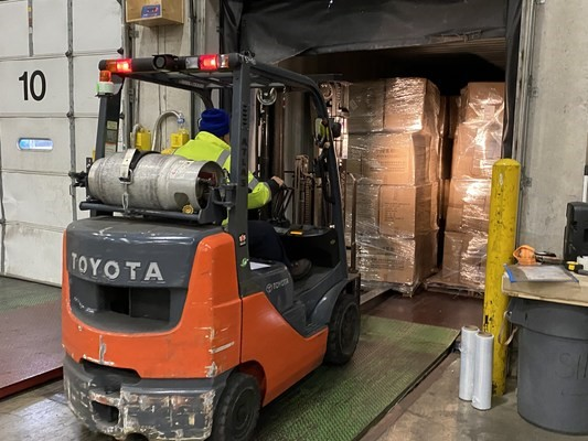 The National Air Cargo group has partnered with 'Food For The Poor' to ship surgical gowns to hospitals in Jamaica and Haiti.