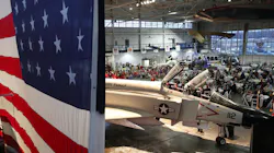 The F-4 Phantom is displayed in front of a large flag as more than 250 people attend the Veterans Day Celebration on Saturday at the MAPS Air Museum. The F-4 Phantom is displayed in front of a large flag as more than 250 people attend the Veterans Day Celebration on Saturday at the MAPS Air Museum.