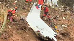 This screengrab taken on March 24, 2022, from video by state broadcaster China Central Television (CCTV) via AFPTV shows rescue teams with a piece of the fuselage as they continue their search at the site of where a China Eastern passenger jet crashed onto a mountainside near Wuzhou City in China's southern Guangxi region. This screengrab taken on March 24, 2022, from video by state broadcaster China Central Television (CCTV) via AFPTV shows rescue teams with a piece of the fuselage as they continue their search at the site of where a China Eastern passenger jet crashed onto a mountainside near Wuzhou City in China's southern Guangxi region.