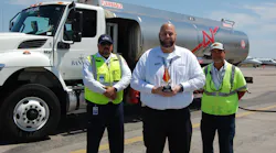 2022 Team Leader of the Year Kenny Gibson (center) works closely with line service technicians, including Alex Casanova (left), and on-the-job trainers like Peter Perez. (right). 2022 Team Leader of the Year Kenny Gibson (center) works closely with line service technicians, including Alex Casanova (left), and on-the-job trainers like Peter Perez. (right).
