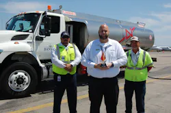 2022 Team Leader of the Year Kenny Gibson (center) works closely with line service technicians, including Alex Casanova (left), and on-the-job trainers like Peter Perez. (right). 2022 Team Leader of the Year Kenny Gibson (center) works closely with line service technicians, including Alex Casanova (left), and on-the-job trainers like Peter Perez. (right).
