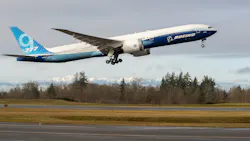 As the Olympic Mountains loom in the distance, the Boeing 777X takes off on its inaugural flight from Paine Field in Everett, Wash., on Saturday, Jan. 25, 2020. The 777X features giant carbon-composite wings, the largest Boeing has ever designed. The wings are so long that to fit at standard airport gates, each has to fold upward on a hinge 11 feet from the tip. As the Olympic Mountains loom in the distance, the Boeing 777X takes off on its inaugural flight from Paine Field in Everett, Wash., on Saturday, Jan. 25, 2020. The 777X features giant carbon-composite wings, the largest Boeing has ever designed. The wings are so long that to fit at standard airport gates, each has to fold upward on a hinge 11 feet from the tip.
