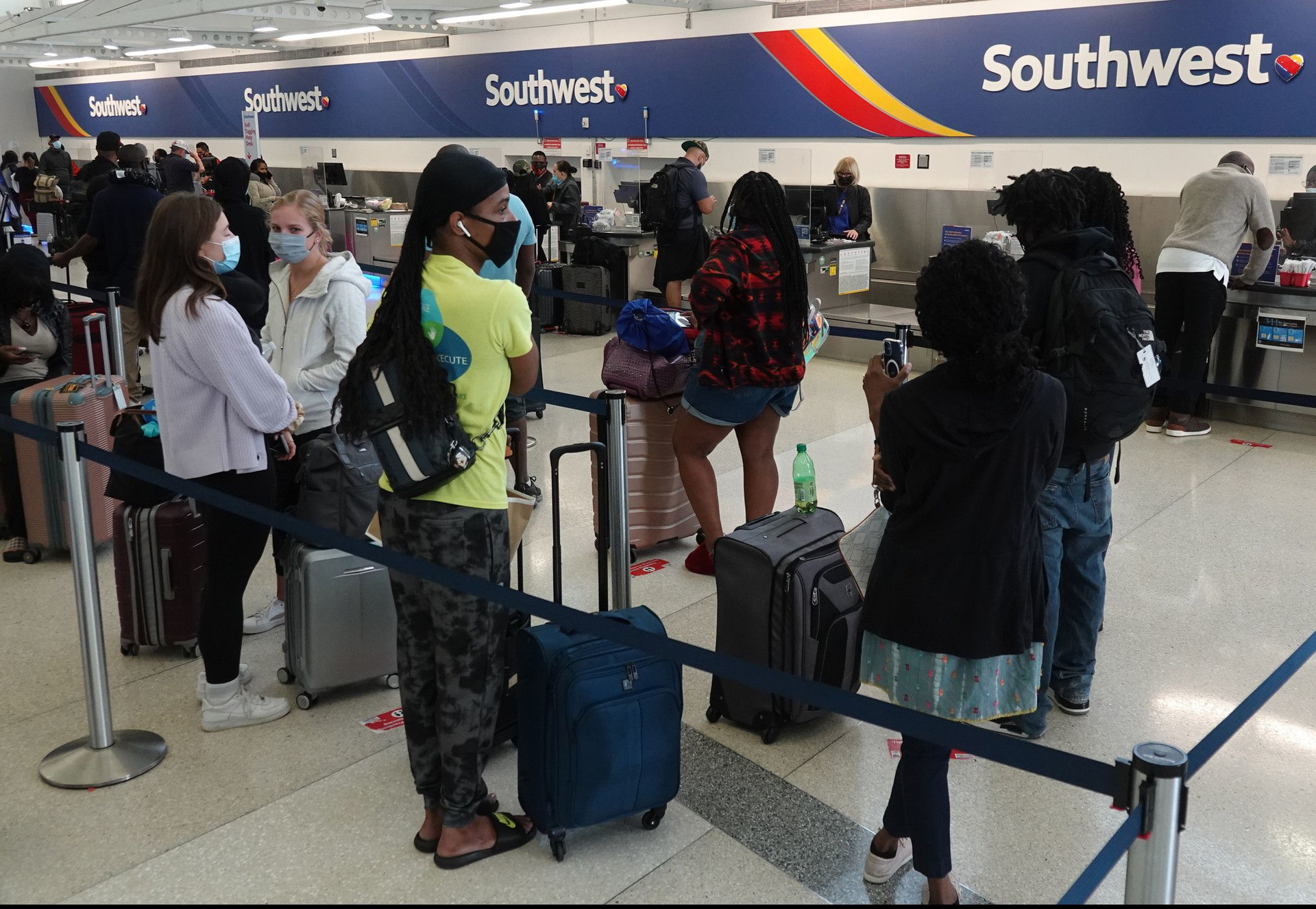 Delayed passengers wait in line at the Southwest Airlines ticket counter at Fort Lauderdale-Hollywood International Airport. During a spate of industry-wide flight delays and cancellation since 2021, airlines serving Florida have blamed bad weather and air traffic control issues. The forthcoming Memorial Day weekend will provide another test for airlines that say they have taken steps to reduce disruptions.