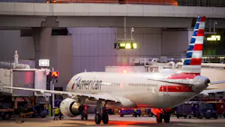 American Airlines planes are seen at the gates of Terminal C at the Skylink train passes overhead on at DFW Airport on Friday, Jan. 7, 2022. American Airlines planes are seen at the gates of Terminal C at the Skylink train passes overhead on at DFW Airport on Friday, Jan. 7, 2022.
