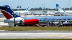 National Transportation Safety Board agents, Federal Aviation Administration agents and Miami-Dade Fire Rescue crews on Wednesday surround the RED Air plane that crash-landed on Tuesday at Miami International Airport. National Transportation Safety Board agents, Federal Aviation Administration agents and Miami-Dade Fire Rescue crews on Wednesday surround the RED Air plane that crash-landed on Tuesday at Miami International Airport.