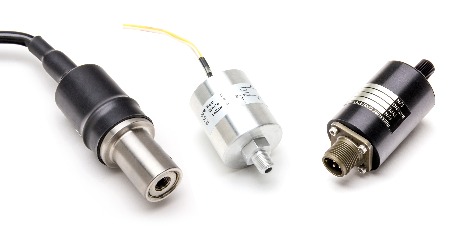Pressure Control, Inc.&rsquo;s Absolute Pressure Switch products pictured in the photo are (from left to right): an SF6 (sulfur hexafluoride) pressure detection switch, a small aircraft altitude switch, and a harsh environment isolated pressure switch.