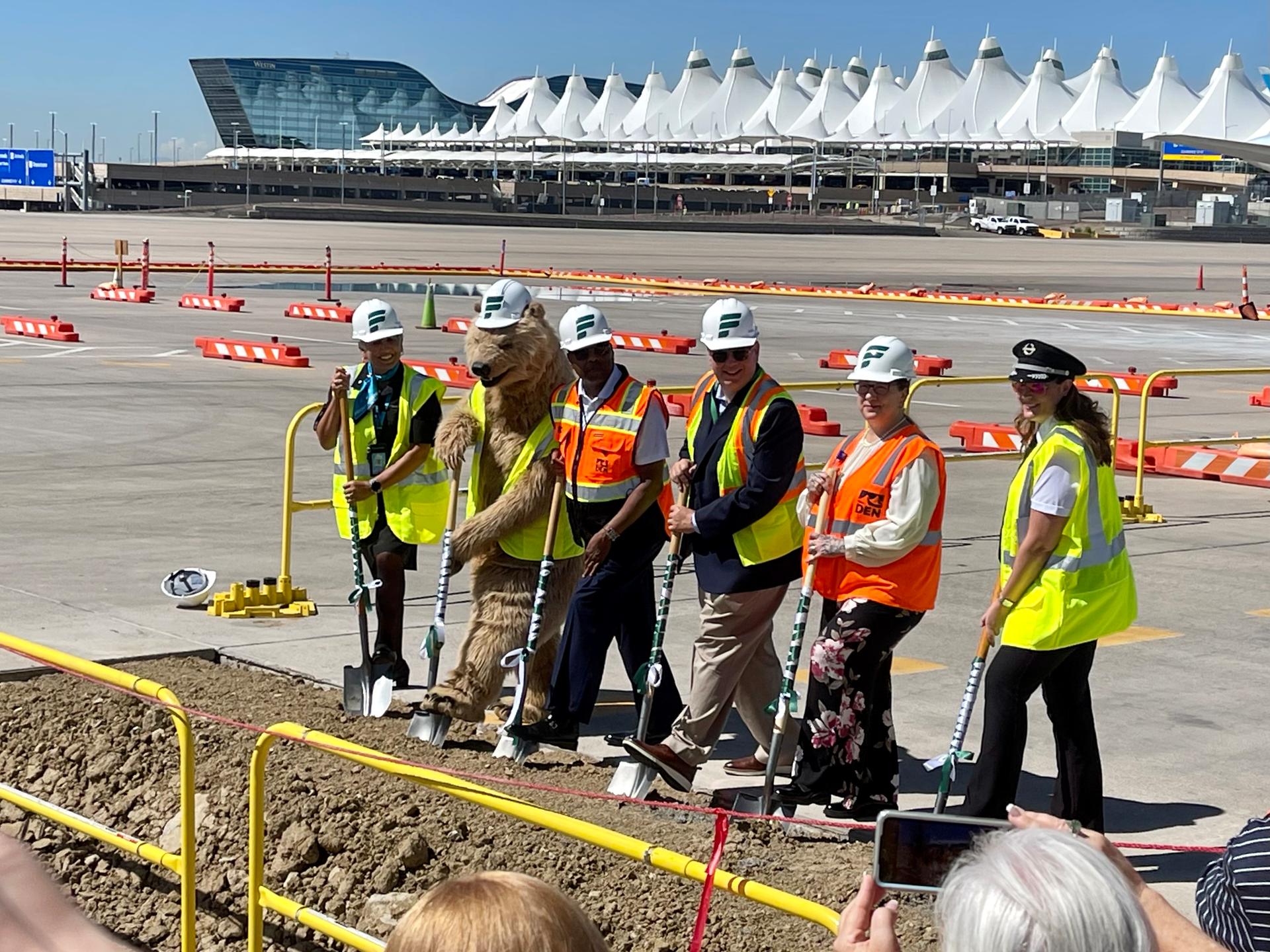 Frontier President and CEO Barry Biffle, Denver International Airport CEO Phil Washington and City of Denver Councilwoman Stacie Gilmore, along with Frontier mascot Griz the Grizzly Bear, placed shovels in the dirt to mark the project&rsquo;s ceremonial groundbreaking.